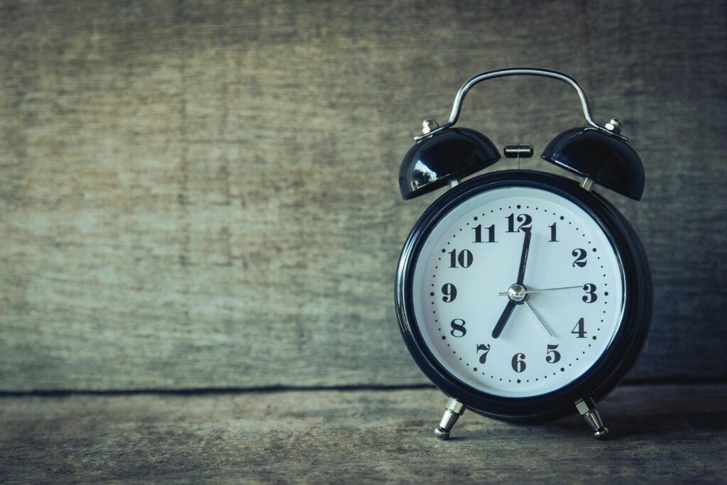 pexels-photo-359989-359989 Classic black analog alarm clock on rustic wooden background, perfect for time and nostalgia themes.
